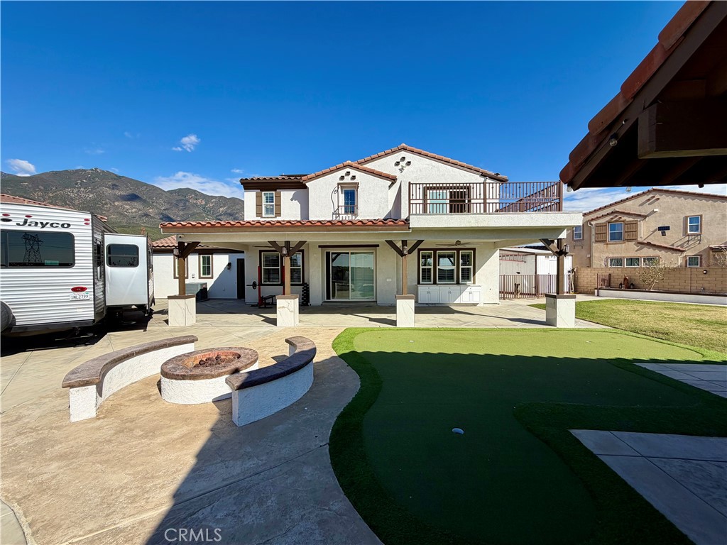 13538 Applegate Court Rancho Cucamonga, CA 91739 - Photo 25 of 30 a front view of a house with swimming pool having outdoor seating