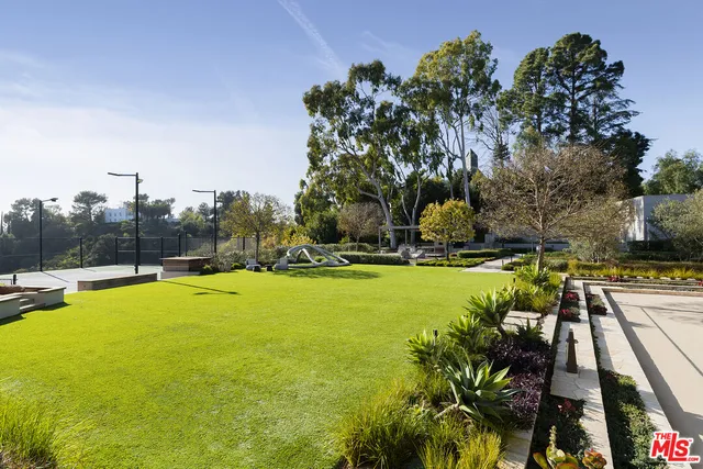 a living room with fireplace furniture and a flat screen tv