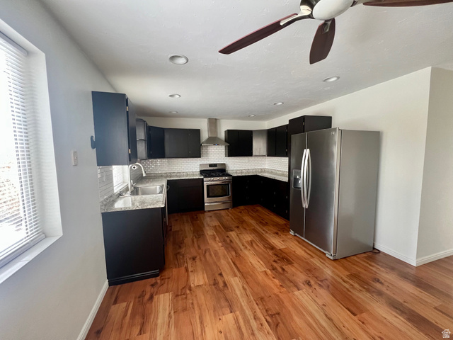 640 West Cyn Road Ferron, UT 84523 - Photo 11 of 45 Kitchen with dark cabinetry, appliances with stainless steel finishes, dark wood-style floors