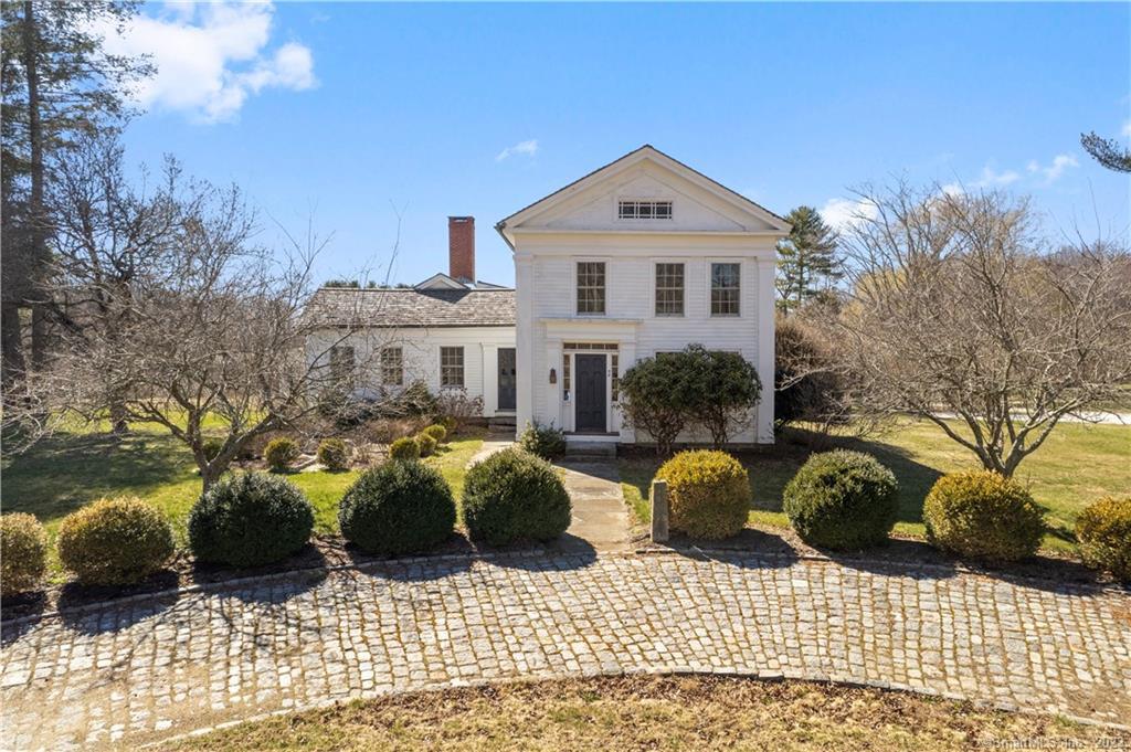 WELCOME HOME... 94 Roast Meat Hill Road offers this circa 1820 Federal Colonial on a picturesque 5-acre parcel. Beautiful curb appeal with a cobblestone circular drive in front, lush landscaping, stonewalls, and a pond on the property.