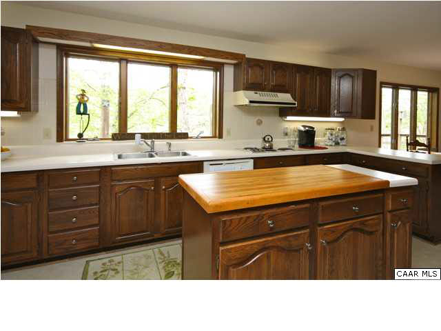 57 Laguna Road Palmyra, VA 22963 - Photo 12 of 32 a kitchen with a sink a window and cabinets