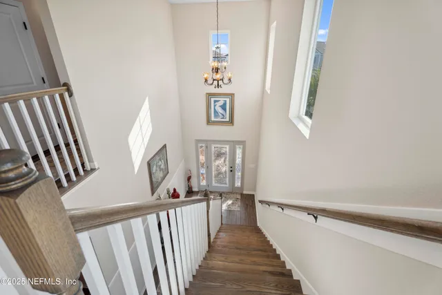a spacious bathroom with a toilet a sink and a mirror