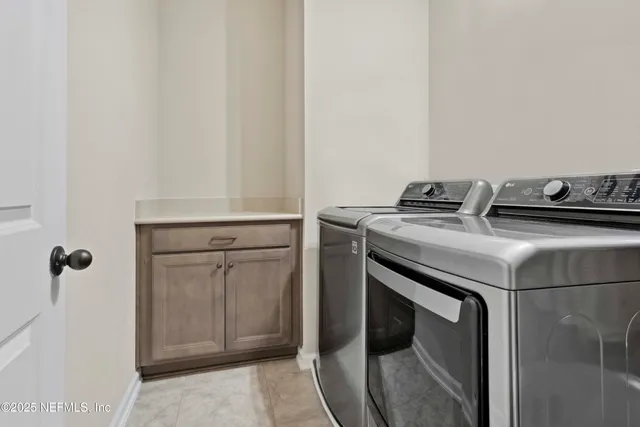 an aerial view of a house with a swimming pool