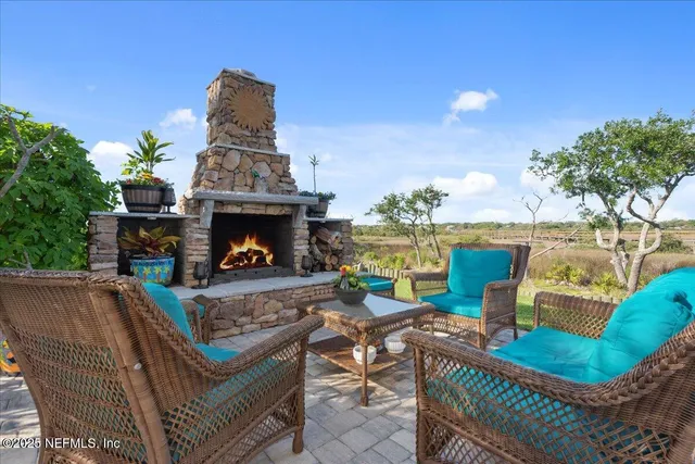 a view of a bench in the backyard of the house