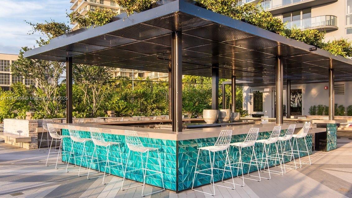 121 Northeast 34th Street, Unit 2811 Miami, FL 33137 - Photo 18 of 35 a view of a porch with sitting area