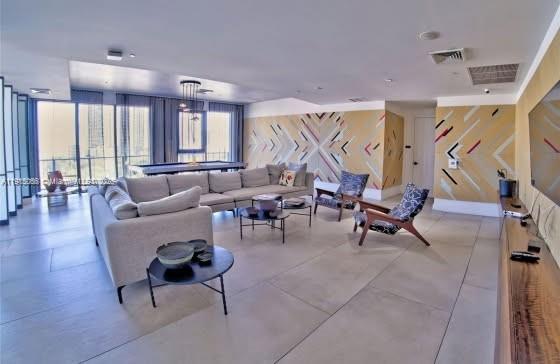 121 Northeast 34th Street, Unit 2811 Miami, FL 33137 - Photo 26 of 35 a living room with furniture and a large window