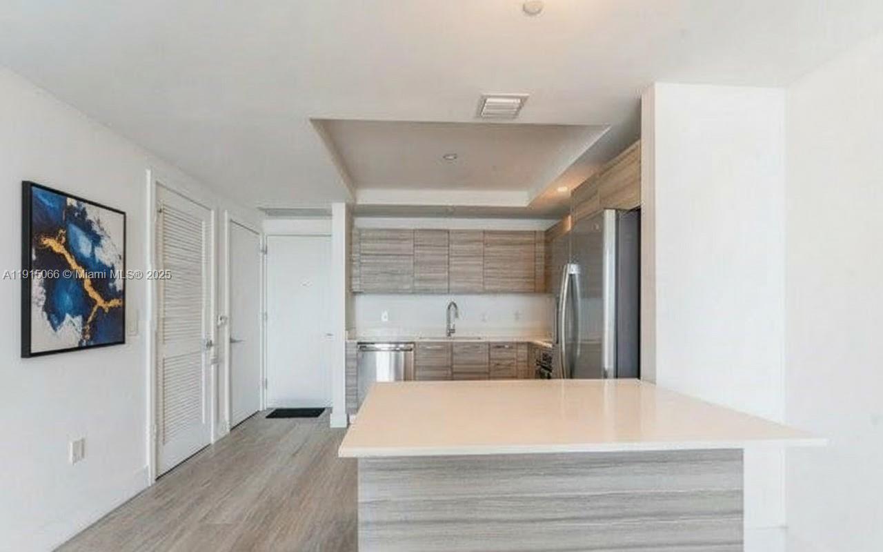 121 Northeast 34th Street, Unit 2811 Miami, FL 33137 - Photo 6 of 35 a room with a bed and a window