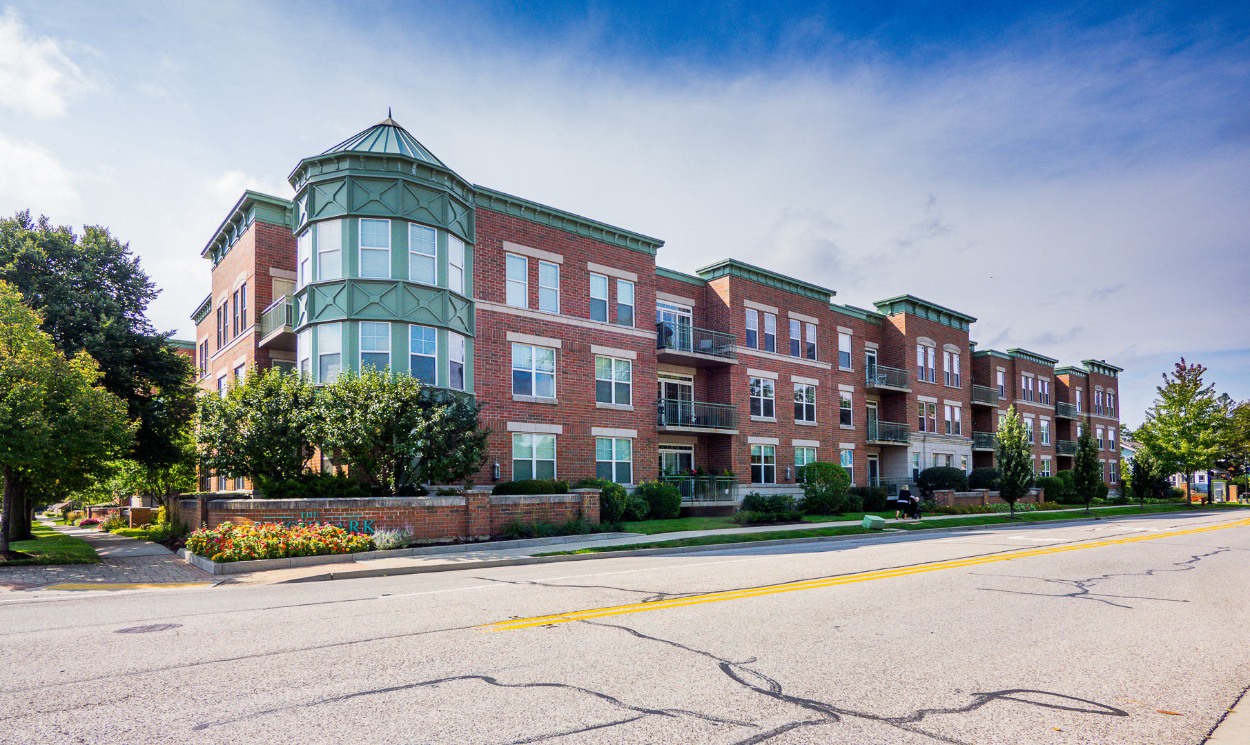 133 West Palatine Road, Unit 103A Palatine, IL 60067 - Photo 15 of 16 a front view of a building with a garden and plants