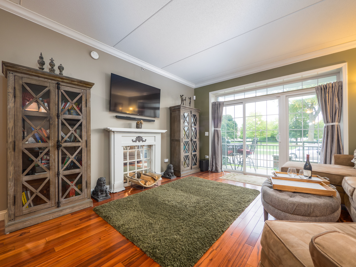 133 West Palatine Road, Unit 103A Palatine, IL 60067 - Photo 5 of 16 a living room with fireplace furniture and a flat screen tv