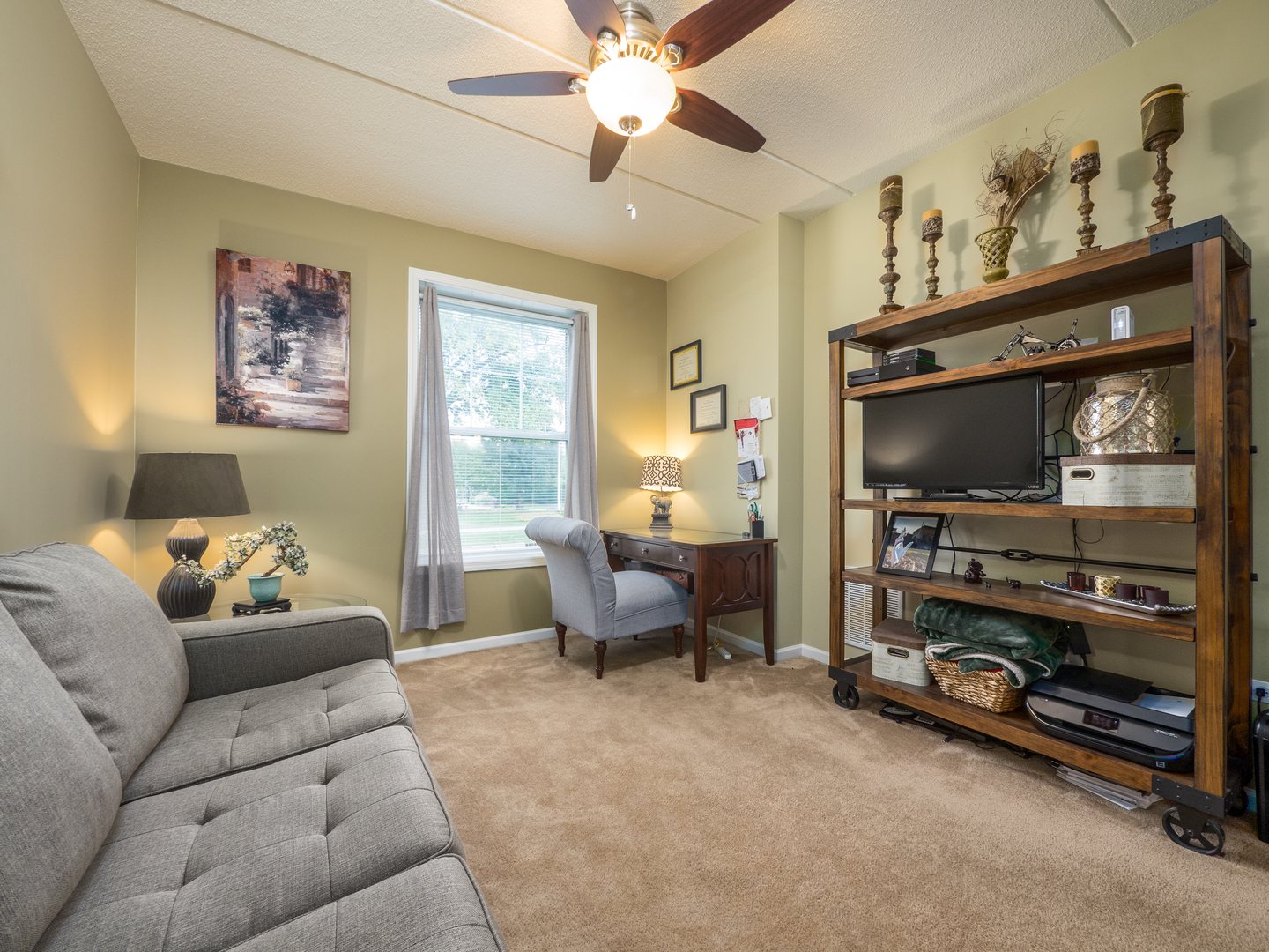 133 West Palatine Road, Unit 103A Palatine, IL 60067 - Photo 10 of 16 a living room with furniture and a flat screen tv