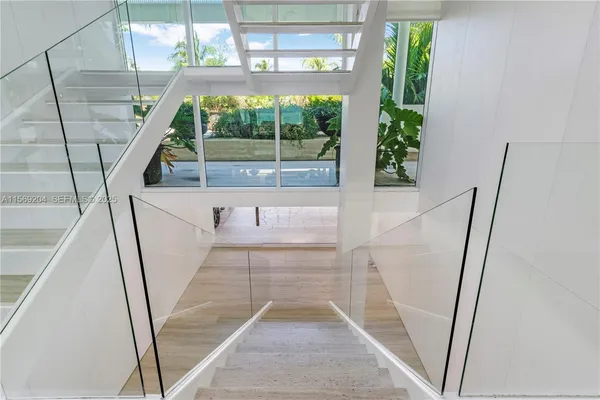 a white bath tub sitting in a bathroom next to a window
