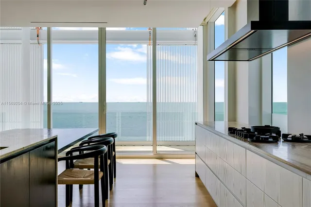 a balcony with furniture and potted plants