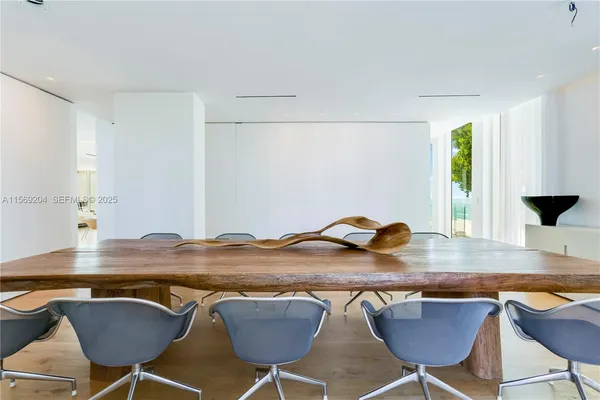 an aerial view of residential houses with outdoor space and river