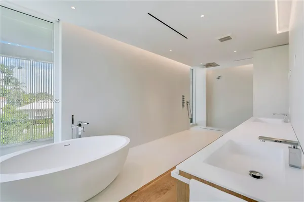 a white bath tub sitting in a bathroom