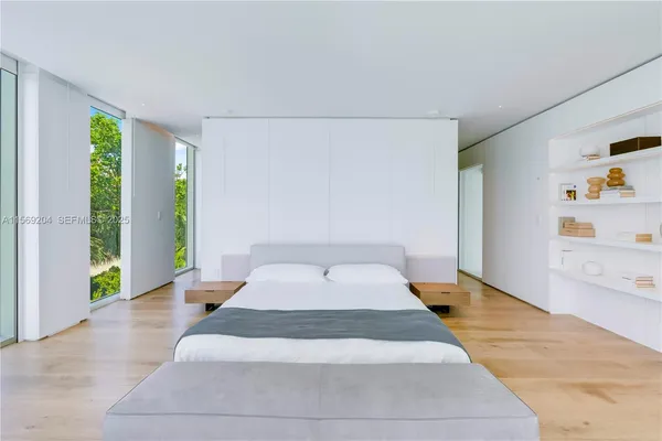 a bedroom with a bed and a table in it