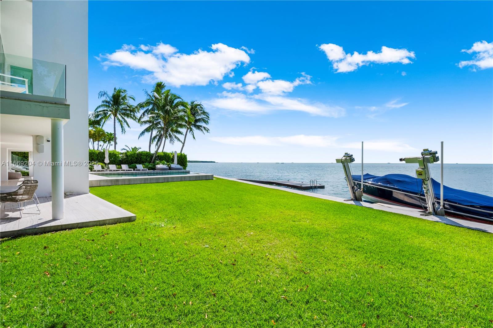 440 South Mashta Drive Key Biscayne, FL 33149 - Photo 47 of 100 a view of a house with a backyard porch and sitting area