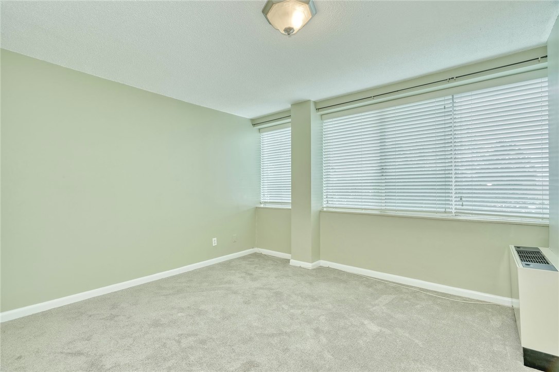 1400 East Avenue, Unit UN412 Rochester, NY 14610 - Photo 13 of 40 Second bedroom with abundant natural light and wal