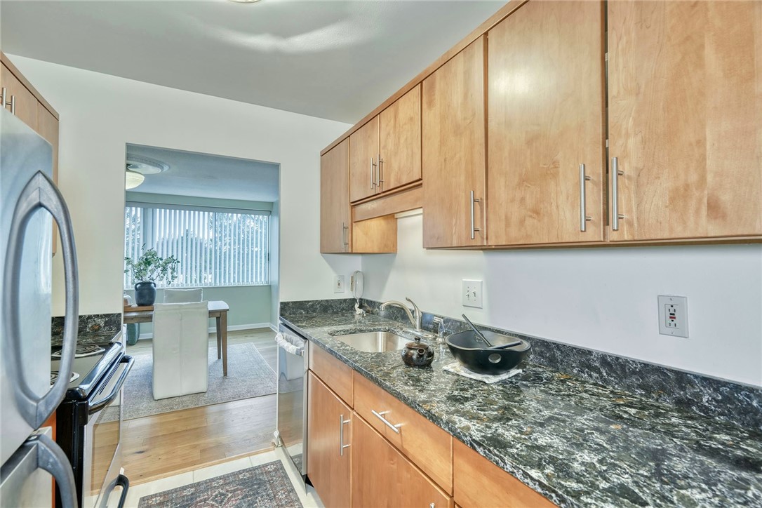 1400 East Avenue, Unit UN412 Rochester, NY 14610 - Photo 26 of 40 Another view of kitchen into dining area.