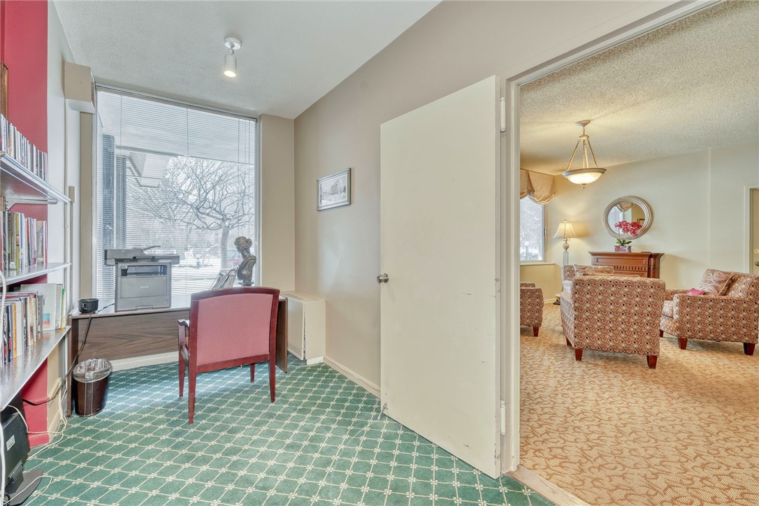 1400 East Avenue, Unit UN412 Rochester, NY 14610 - Photo 33 of 40 Shared library and communal living area on first f