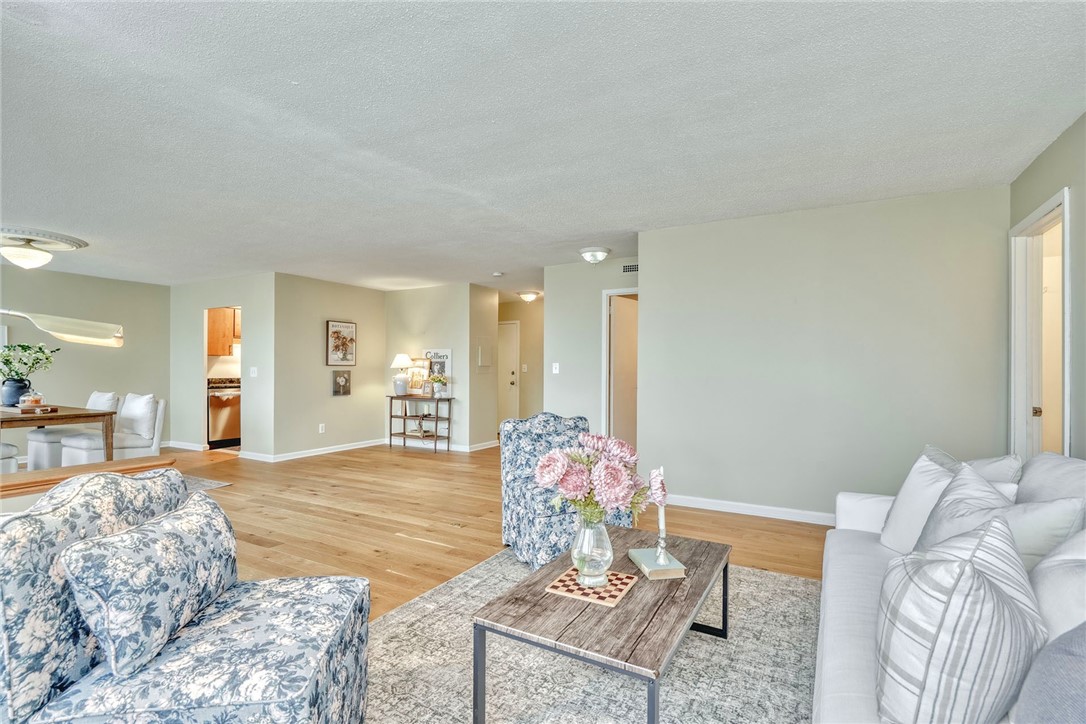 1400 East Avenue, Unit UN412 Rochester, NY 14610 - Photo 4 of 40 Opposing view of the open hardwood living room and