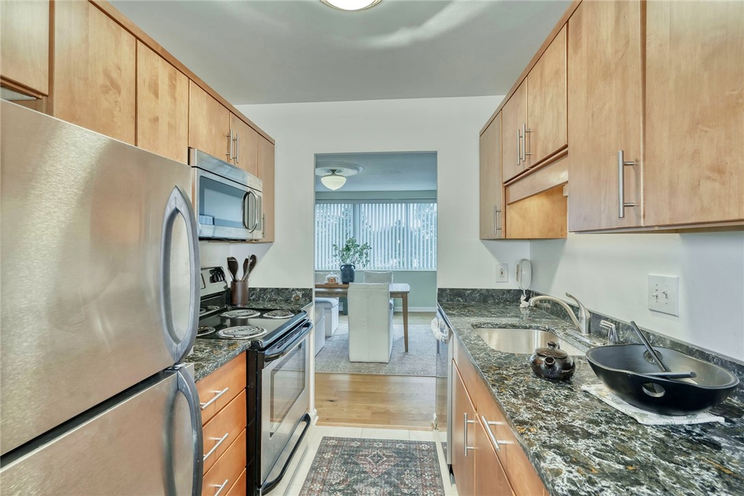 1400 East Avenue, Unit UN412 Rochester, NY 14610 - Photo 8 of 40 Kitchen featuring beautiful built-in cabinetry for