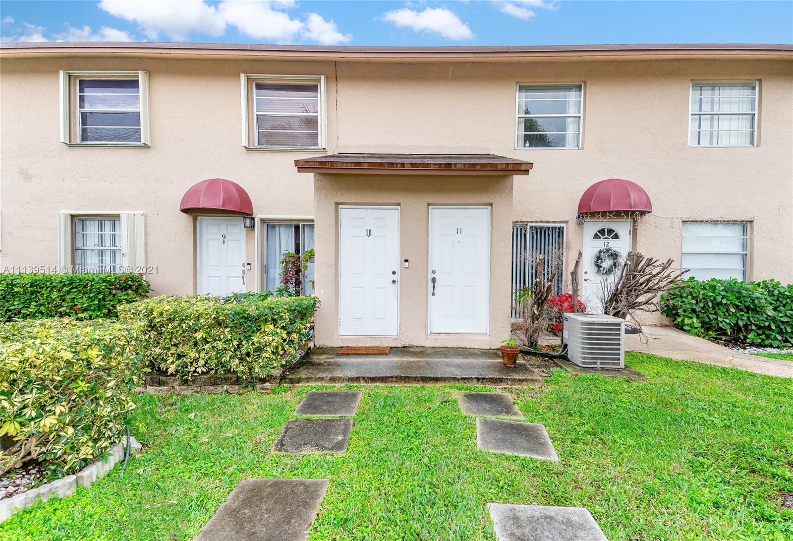 a front view of a house with yard