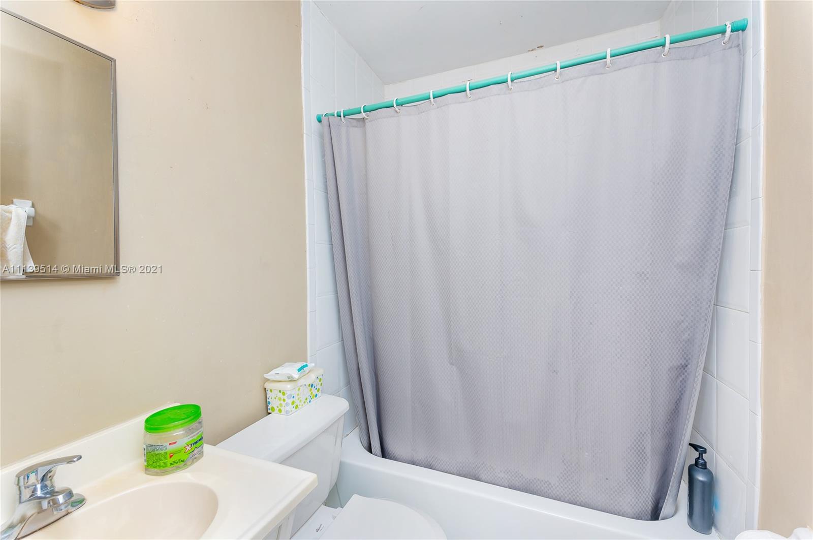 15280 Southwest 80th Street, Unit 11 Miami, FL 33193 - Photo 12 of 13 a bathroom with a sink and a toilet