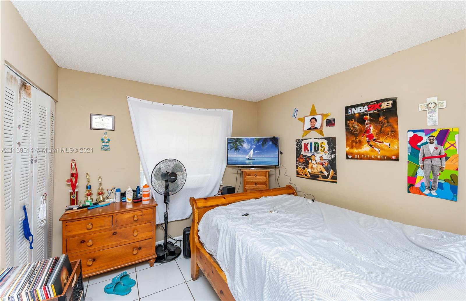 15280 Southwest 80th Street, Unit 11 Miami, FL 33193 - Photo 10 of 13 a bed room with a bed and furniture
