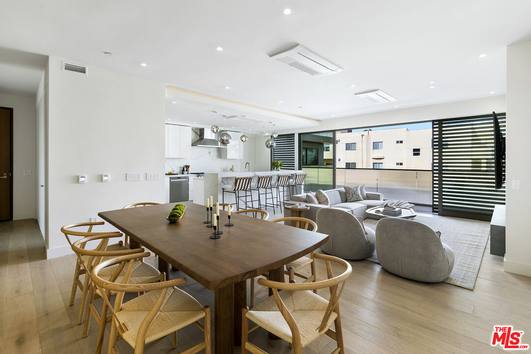 1644 Malcolm Avenue, Unit 420 Los Angeles, CA 90024 - Photo 13 of 64 a view of a dining room with furniture and wooden floor