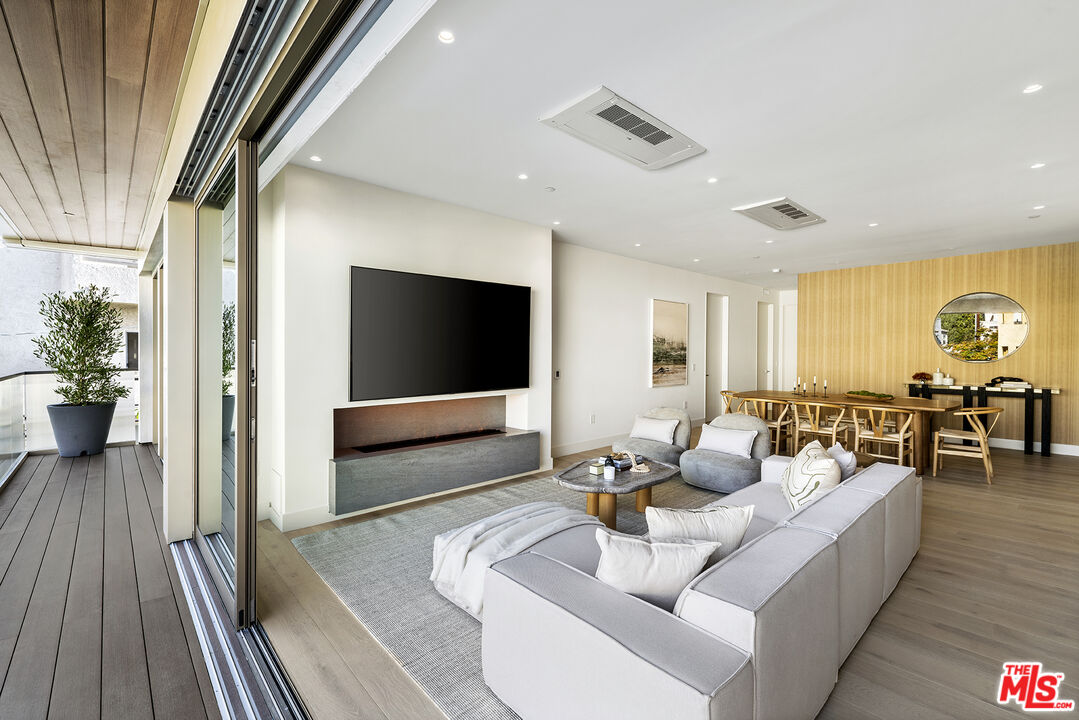 1644 Malcolm Avenue, Unit 420 Los Angeles, CA 90024 - Photo 16 of 64 a living room with furniture and a flat screen tv