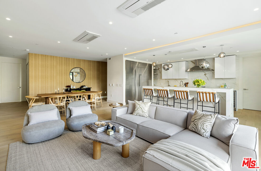 1644 Malcolm Avenue, Unit 420 Los Angeles, CA 90024 - Photo 17 of 64 a living room with furniture and a large window