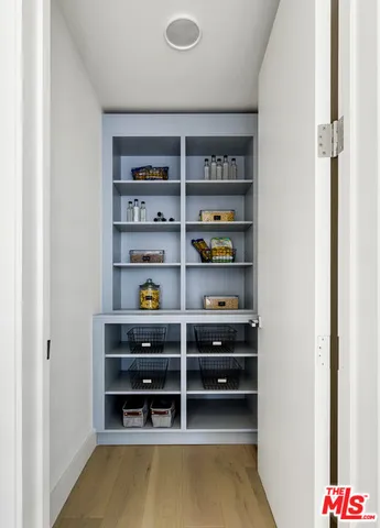 a bedroom with a bed and a night stand