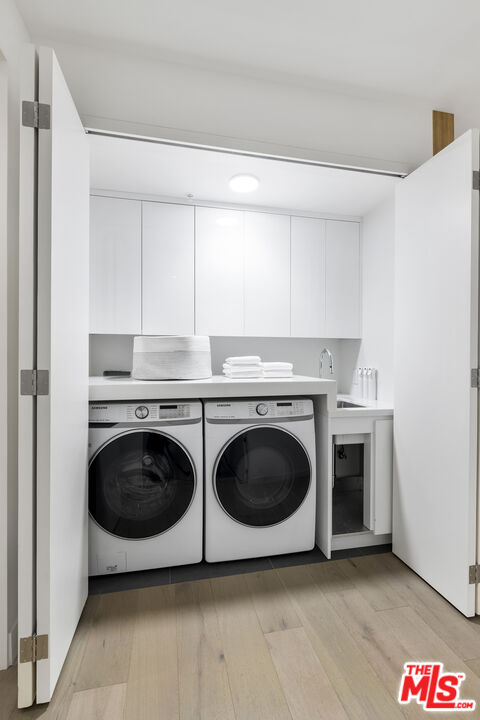 1644 Malcolm Avenue, Unit 420 Los Angeles, CA 90024 - Photo 25 of 64 a utility room with dryer and washer