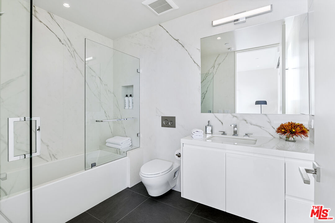 1644 Malcolm Avenue, Unit 420 Los Angeles, CA 90024 - Photo 28 of 64 a bathroom with a sink toilet tub and shower