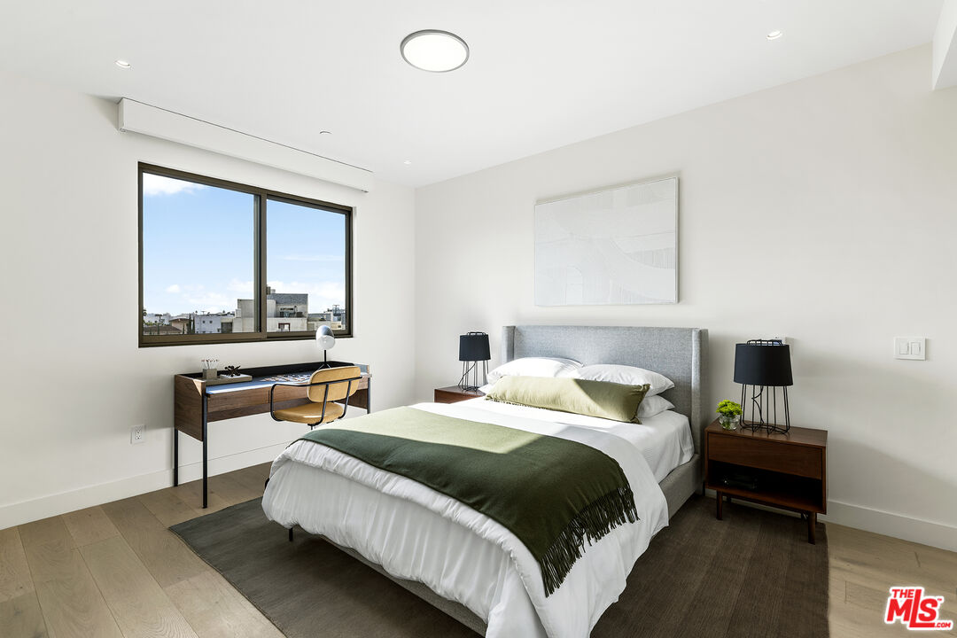 1644 Malcolm Avenue, Unit 420 Los Angeles, CA 90024 - Photo 29 of 64 a bedroom with a bed and a night stand