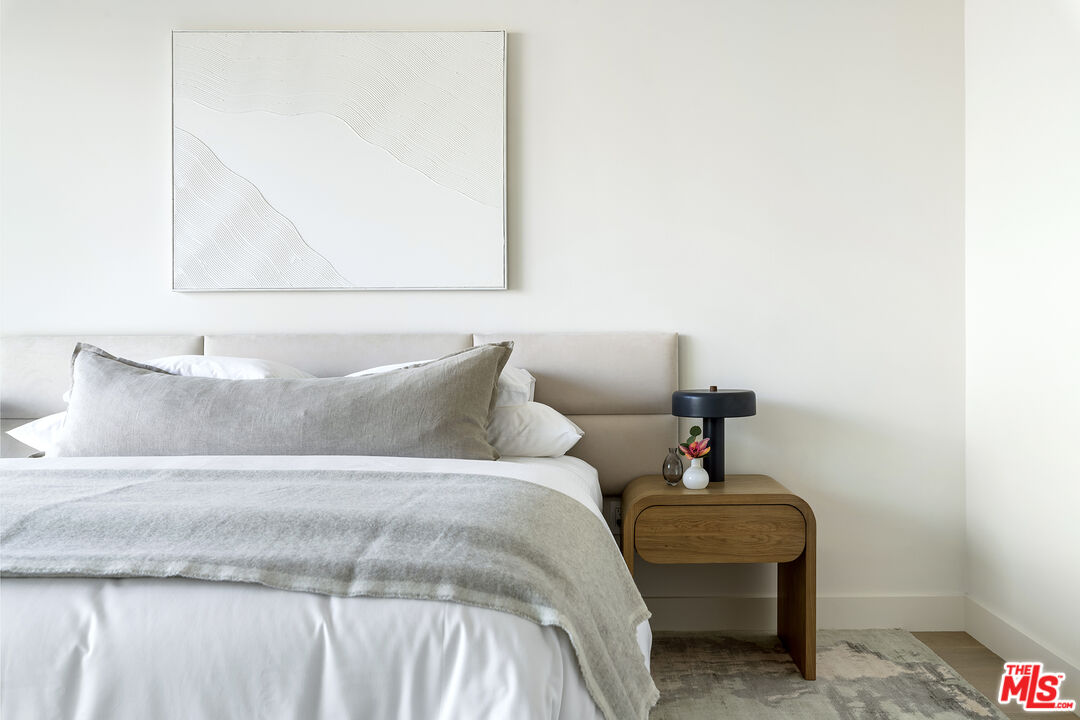 1644 Malcolm Avenue, Unit 420 Los Angeles, CA 90024 - Photo 35 of 64 a bed room with a bed and a mirror