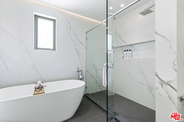 a view of a swimming pool with a patio and a yard