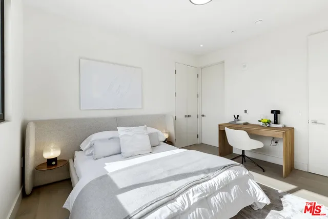 a view of a terrace with couches and lounge chairs