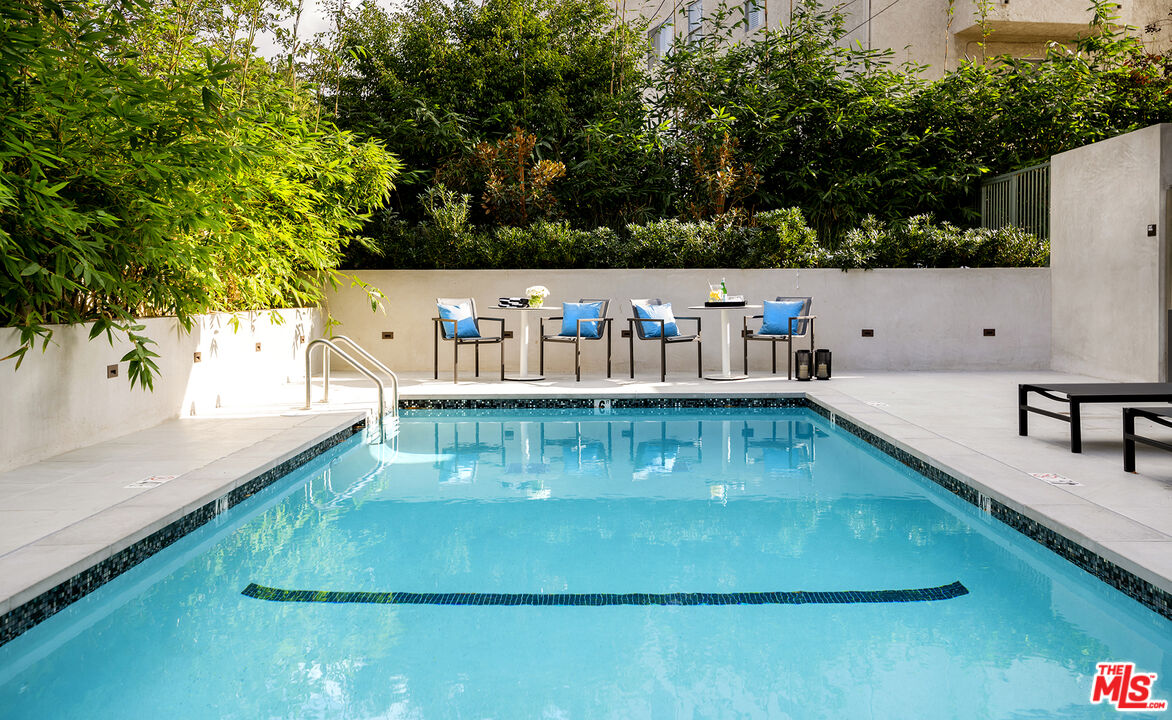 1644 Malcolm Avenue, Unit 420 Los Angeles, CA 90024 - Photo 48 of 64 a view of a swimming pool with a patio and a yard