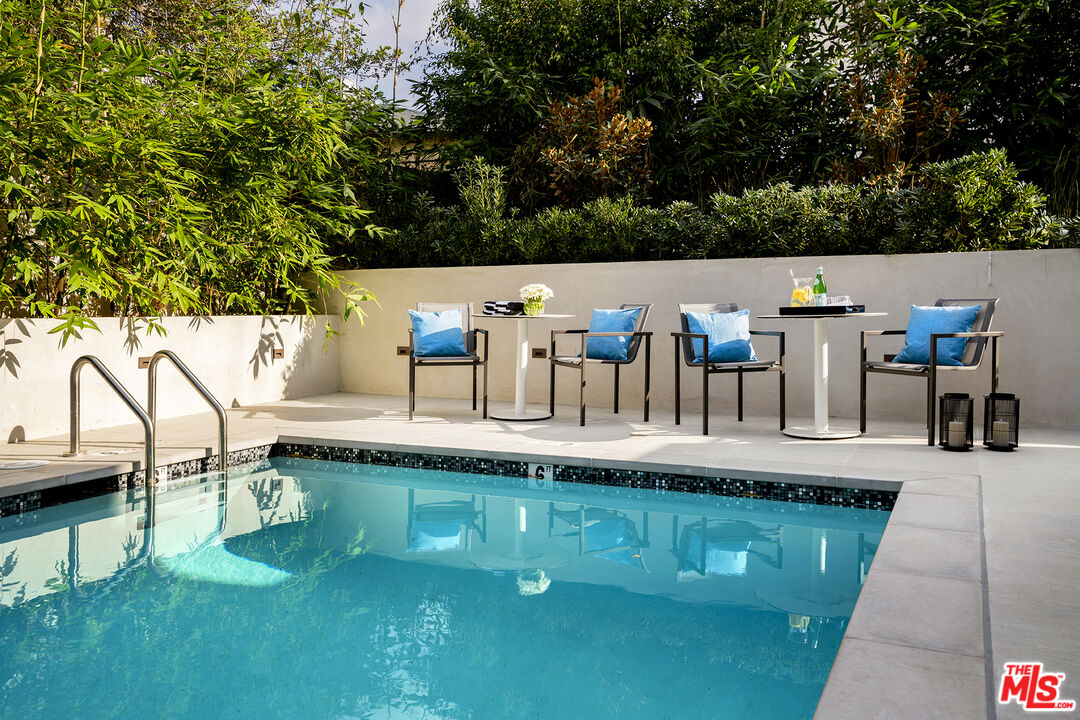 1644 Malcolm Avenue, Unit 420 Los Angeles, CA 90024 - Photo 49 of 64 a view of a swimming pool with a patio
