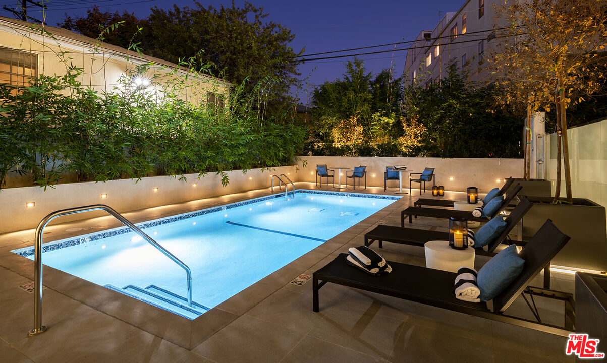 1644 Malcolm Avenue, Unit 420 Los Angeles, CA 90024 - Photo 58 of 64 a view of a swimming pool with a patio