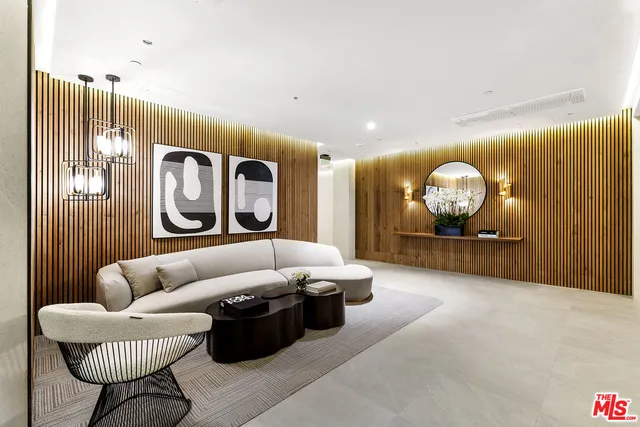 a living room with a table and chairs