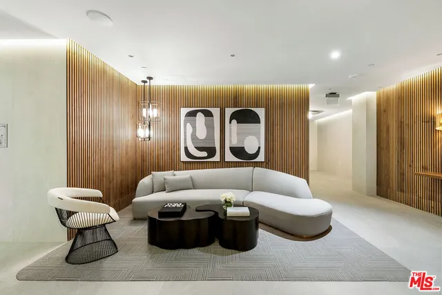 a view of a room with furniture and wooden floor