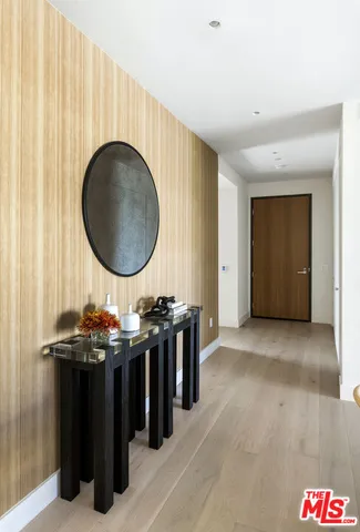 a view of a a dining room with furniture window and wooden floor