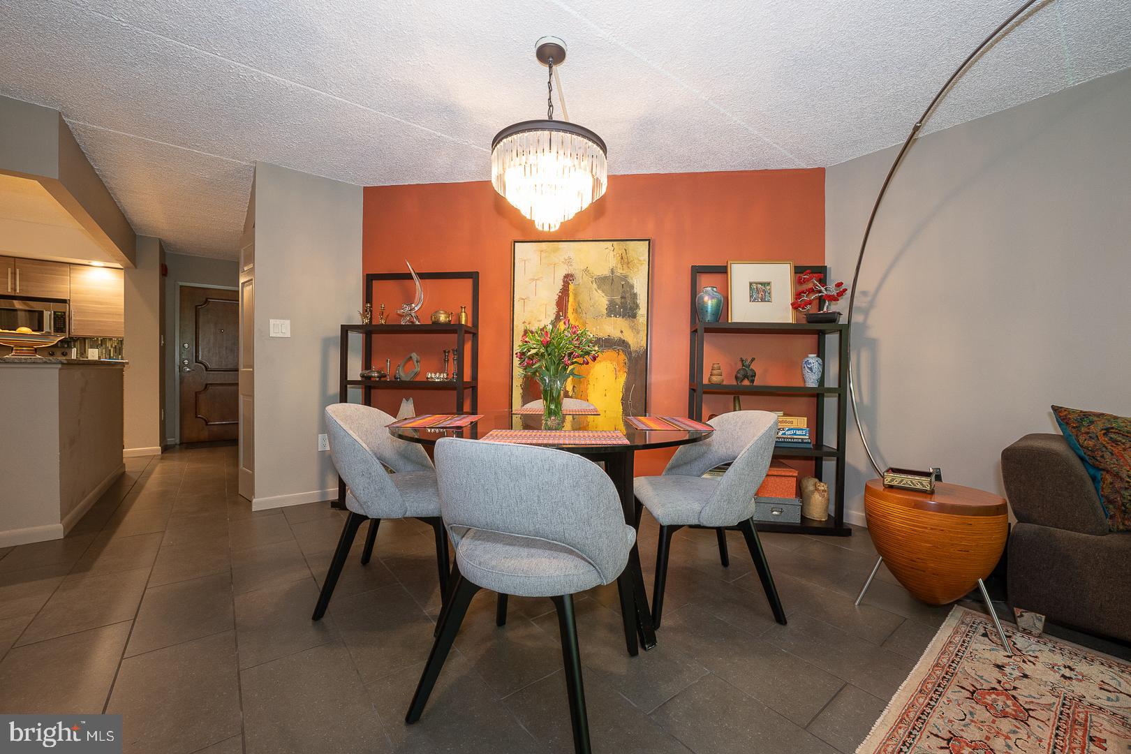 19 Rock Hill Road, Unit 1F Bala Cynwyd, PA 19004 - Photo 11 of 35 a view of a dining room with furniture window and wooden floor