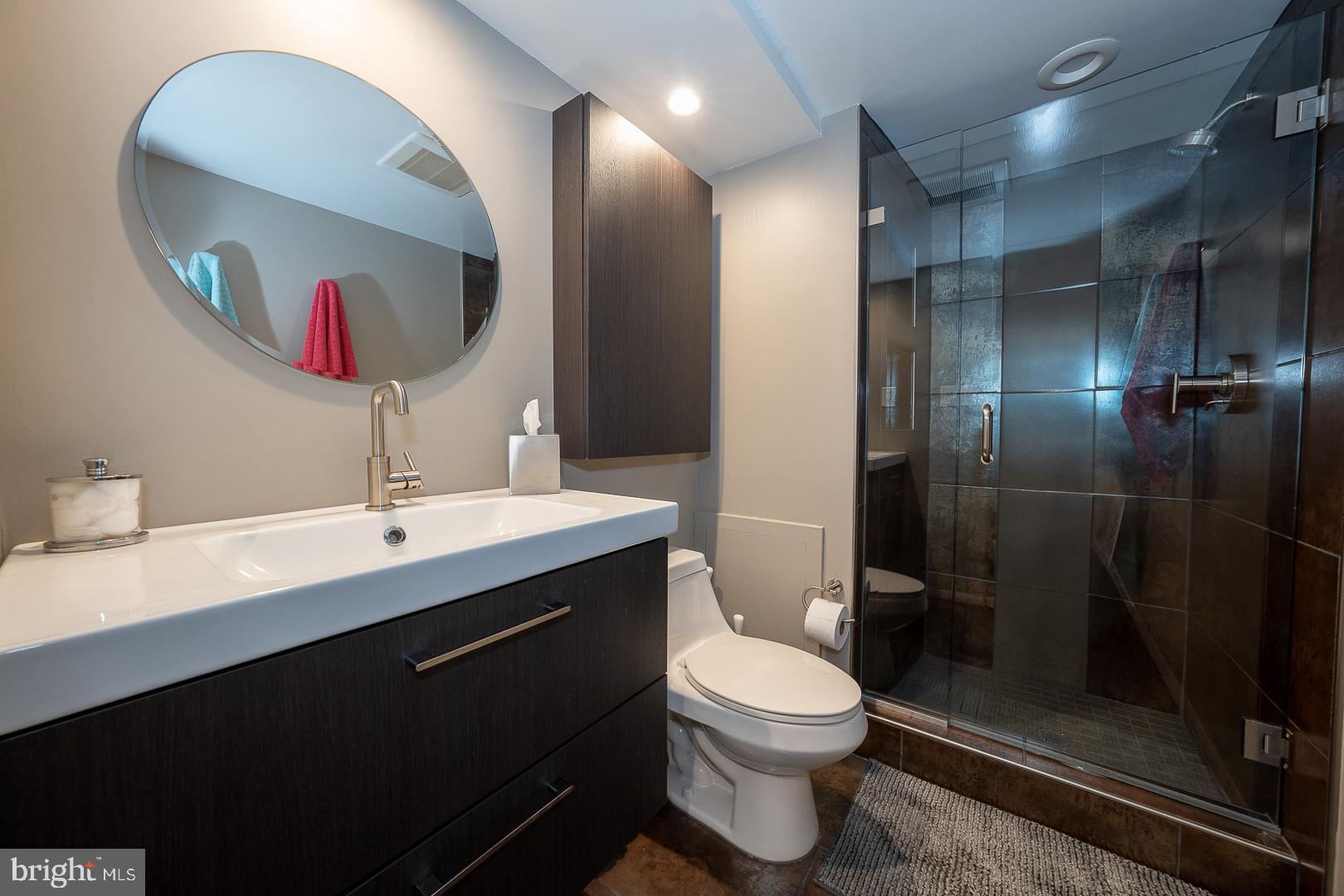 19 Rock Hill Road, Unit 1F Bala Cynwyd, PA 19004 - Photo 26 of 35 a bathroom with a toilet sink double vanity and mirror
