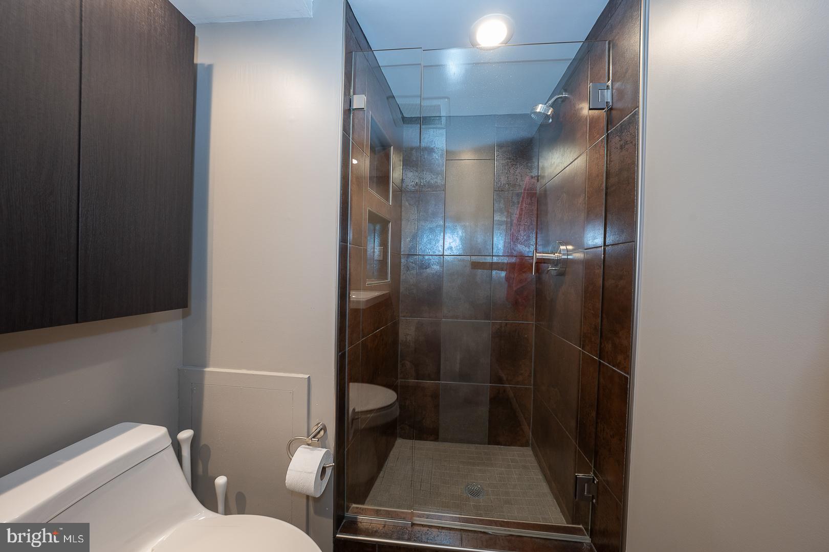 19 Rock Hill Road, Unit 1F Bala Cynwyd, PA 19004 - Photo 27 of 35 a bathroom with a shower and toilet