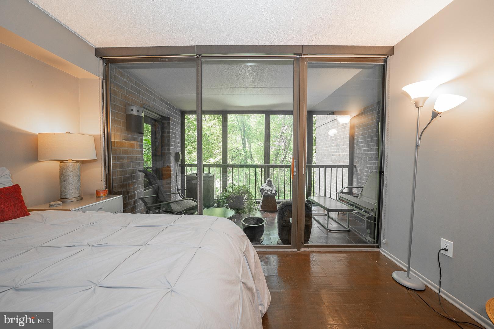 19 Rock Hill Road, Unit 1F Bala Cynwyd, PA 19004 - Photo 29 of 35 a bedroom with a bed and a large window