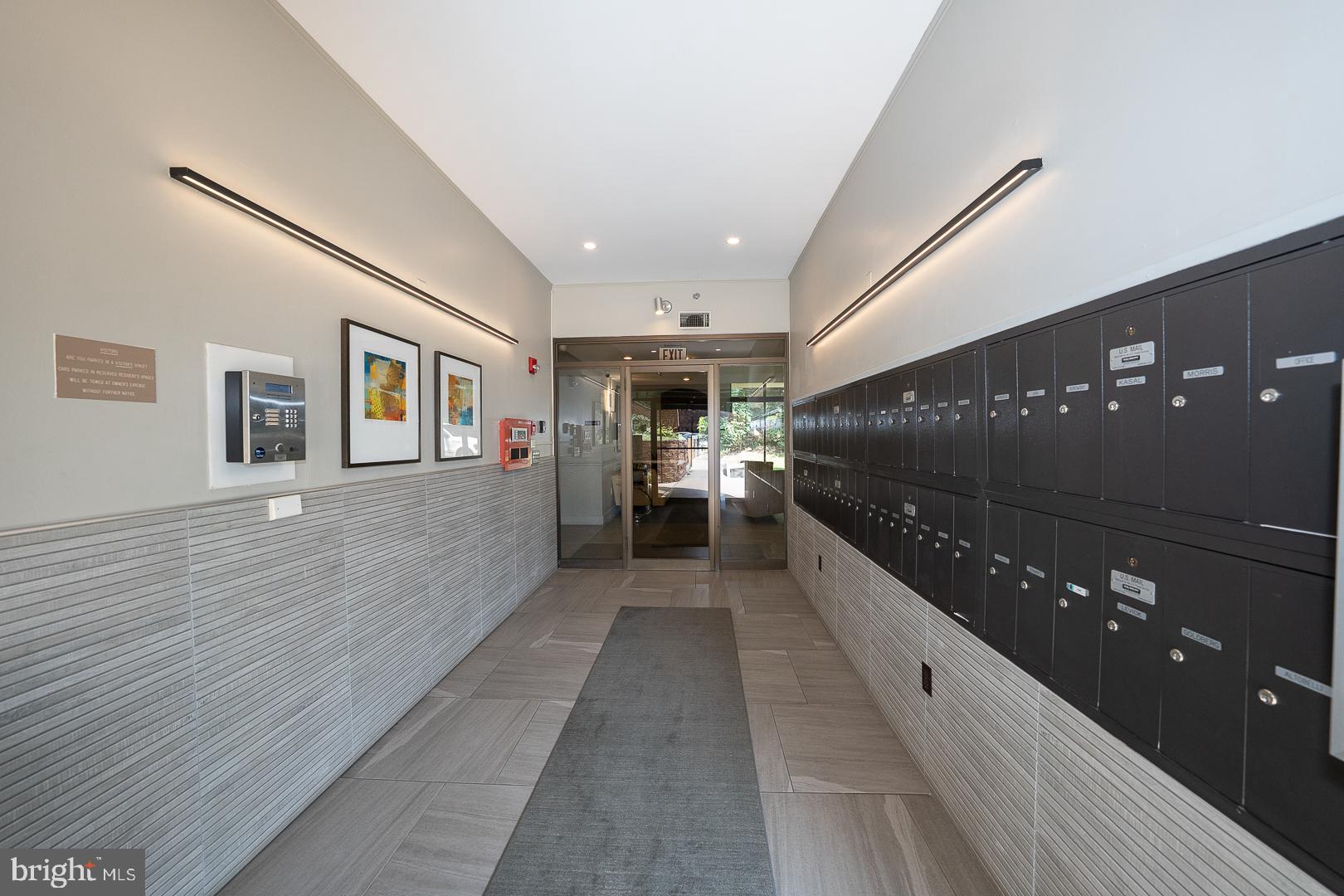 19 Rock Hill Road, Unit 1F Bala Cynwyd, PA 19004 - Photo 5 of 35 a view of a hallway with wooden floor