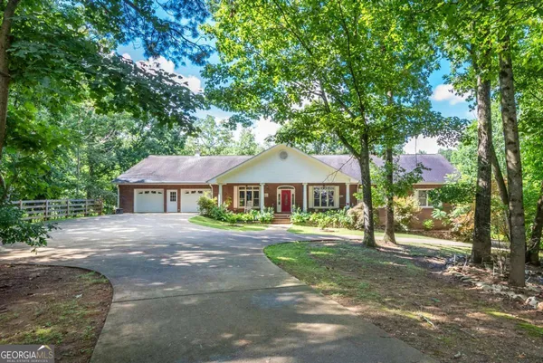 a view of a livingroom with furniture and a window